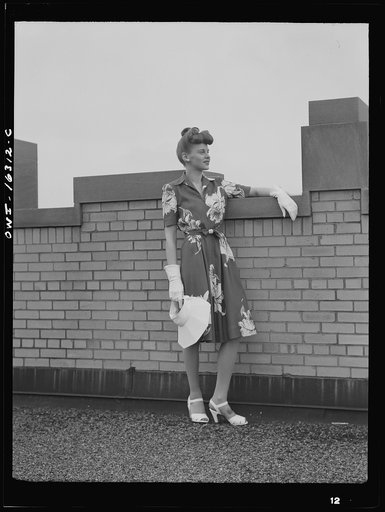 Untitled photo, possibly related to: Detroit, Michigan. Fashion show presented by the Chrysler Girls' Club of the Chrysler Corporation at Saks Fifth Avenue store. Girl laughing