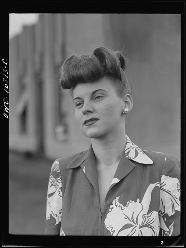 Untitled photo, possibly related to: Detroit, Michigan. Fashion show presented by the Chrysler Girls' Club of the Chrysler Corporation at Saks Fifth Avenue store. Girl laughing