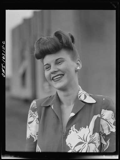 Detroit, Michigan. Fashion show presented by the Chrysler Girls' Club of the Chrysler Corporation at Saks Fifth Avenue store. Girl laughing