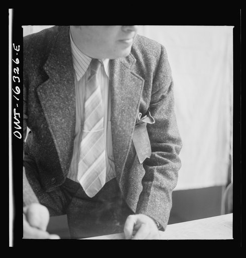 Untitled photo, possibly related to: Dearborn, Michigan. National Labor Relations Board election for union representation at the River Rouge Ford plant. Workers voting in a secret booth
