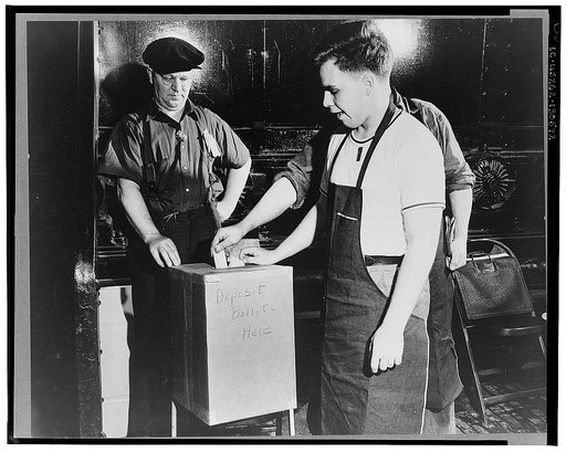 Dearborn, Michigan. National Labor Relations Board election for union representation at the River Rouge Ford plant. Workers depositing ballot in ballot box