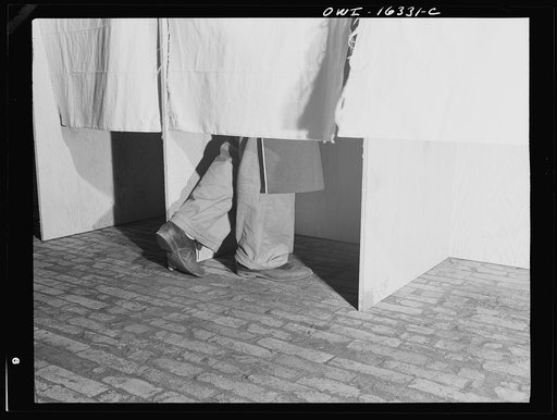 Dearborn, Michigan. National Labor Relations Board election for union representation at the River Rouge Ford plant. Workers voting in a secret booth