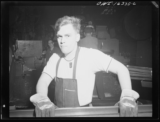 Untitled photo, possibly related to: Dearborn, Michigan. Workers in the River Rouge Ford plant bending metal strips to form window frames for automobiles