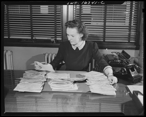 Detroit, Michigan. A box for suggestions from workers installed in the Cadillac motor car division of General Motors Corporation (?). Checking workers' suggestions