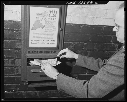 Detroit, Michigan. A box for suggestions from workers installed in the Cadillac motor car division of General Motors Corporation (?). Close up of suggestion box