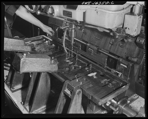 Detroit, Michigan. Results of constructive suggestions placed by workers in a box for this purpose in the Cadillac motor car division of General Motors Corporation (?). Crank shaft boring maching with a jig plate to prevent mistakes, as suggested by a worker