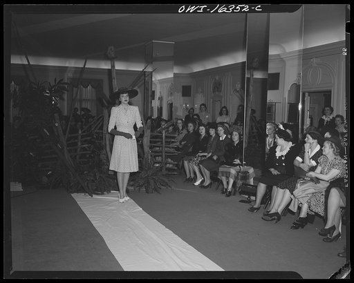 Untitled photo, possibly related to: Detroit, Michigan. Style show of clothes worn by better-dressed office workers, presented by the Chrysler Girls' Club of the Chrysler Corporation at Saks Fifth Avenue store. Chrysler girl modeling a suit
