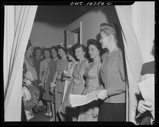 Detroit, Michigan. Fashion show presented by the Chrysler Girls' Club of the Chrysler Corporation at Saks Fifth Avenue store. Chrysler girls who are modeling clothes waiting for their turn to go on