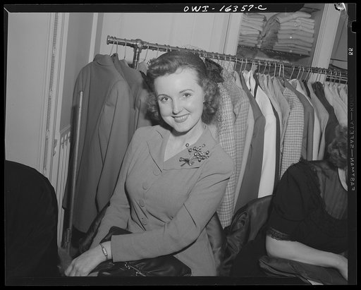 Detroit, Michigan. A Chrysler girl at Saks Fifth Avenue store following a fashion show presented by the Chrysler Girls' Club of the Chrysler Corporation