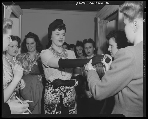 Untitled photo, possibly related to: Detroit, Michigan. Fashion show presented by the Chrysler Girls' Club of the Chrysler Corporation at Saks Fifth Avenue store. Chrysler girls who are modeling clothes waiting for their turn to go on