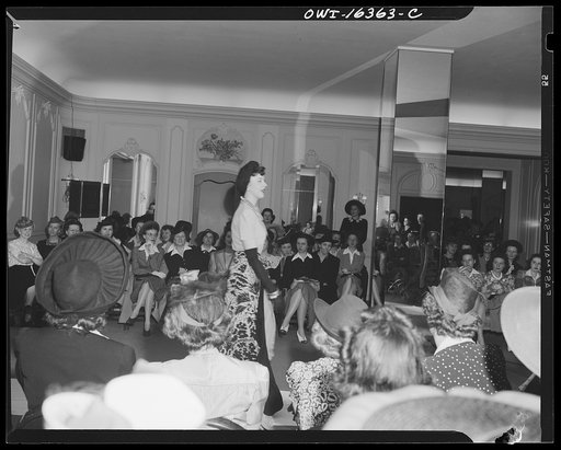Untitled photo, possibly related to: Detroit, Michigan. Style show of clothes worn by better-dressed office workers, presented by the Chrysler Girls' Club of the Chrysler Corporation at Saks Fifth Avenue store. Chrysler girl modeling a suit
