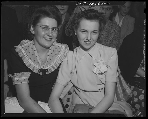 Detroit, Michigan. Two Chrysler girl workers at Saks Fifth Avenue store following a fashion show presented by the Chrysler Girls' Club of the Chrysler Corporation