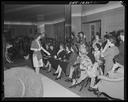 Untitled photo, possibly related to: Detroit, Michigan. Fashion show presented by the Chrysler Girls' Club of the Chrysler Corporation at Saks Fifth Avenue store. Chrysler girls watching a model