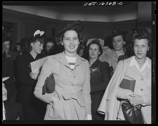 Detroit, Michigan. A Chrysler girl worker at Saks Fifth Avenue store following a fashion show presented by the Chrysler Girls' Club of the Chrysler Corporation