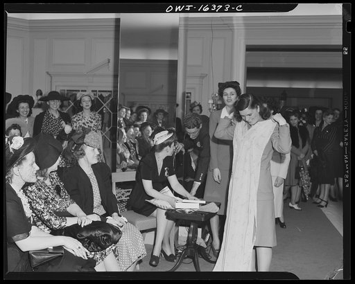 Untitled photo, possibly related to: Detroit, Michigan. Fashion show presented by the Chrysler Girls' Club of the Chrysler Corporation at Saks Fifth Avenue store. Chrysler girls watching a model