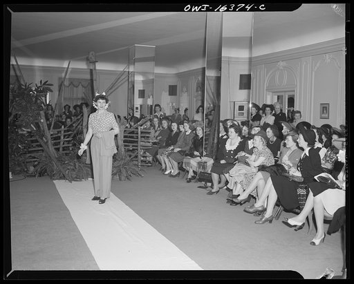 Untitled photo, possibly related to: Detroit, Michigan. Fashion show presented by the Chrysler Girls' Club of the Chrysler Corporation at Saks Fifth Avenue store. Chrysler girls watching a model