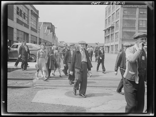 Detroit, Michigan. Girls and men coming out of the Highland Park Chrysler plant