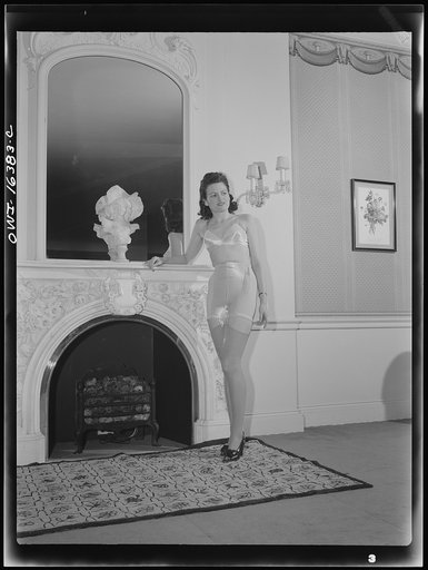 Detroit, Michigan. Fashion show presented by the Chrysler Girls' Club of the Chrysler Corporation at Saks Fifth Avenue store. Girl modeling brassiere and pantie girdle
