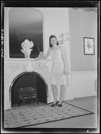 Untitled photo, possibly related to: Detroit, Michigan. Fashion show presented by the Chrysler Girls' Club of the Chrysler Corporation at Saks Fifth Avenue store. Girl modeling brassiere and pantie girdle