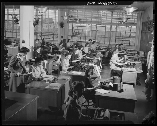 Detroit, Michigan. Office workers at the Chrysler Corporation at work typing various forms