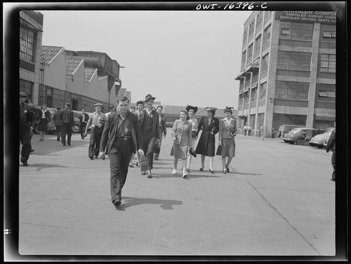 Detroit, Michigan. Men and women workers coming out of the Chrysler Corporation