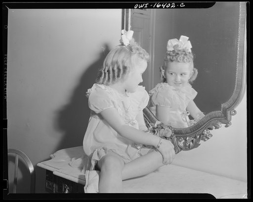 Untitled photo, possibly related to: Detroit, Michigan. Two little girls in their party dresses at a hair styling show