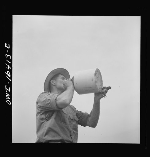 Jackson, Michigan. Taking a drink of water from the crockery jug