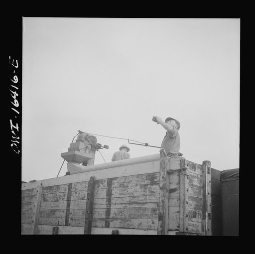 Untitled photo, possibly related to: Jackson, Michigan. Part of a threshing machine