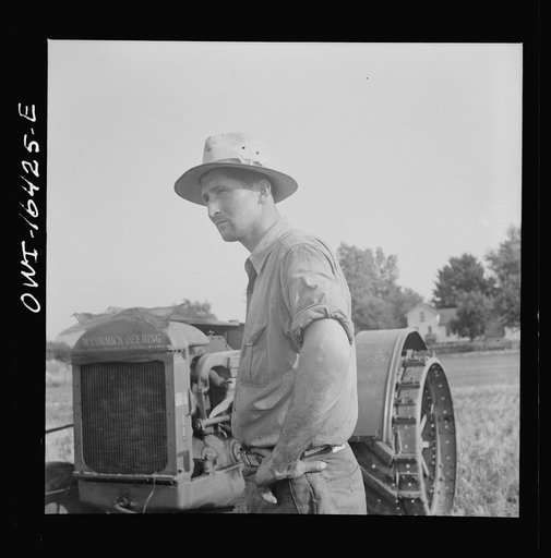 Untitled photo, possibly related to: Jackson, Michigan. Farmer receiving a chaw of tobacco