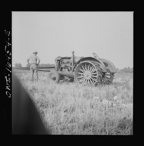 Untitled photo, possibly related to: Jackson, Michigan. Tractor which runs a threshing machine