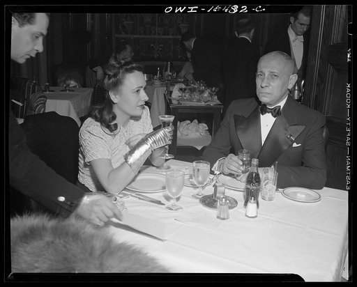 Untitled photo, possibly related to: Detroit, Michigan. Erich Von Strohein [i.e. Stroheim] and a girlfriend eating dinner on New Year's night