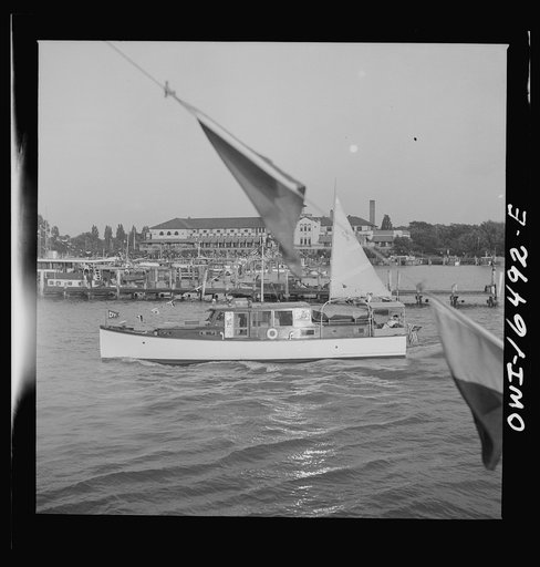 Detroit, Michigan. A Venetian night party at the Detroit yacht club, whose members represent the wealthier class of manufacturers and their friends. A typical small motorboat