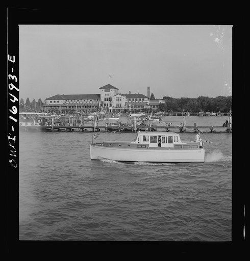 Detroit, Michigan. A Venetian night party at the Detroit yacht club, whose members represent the wealthier class of manufacturers and their friends. Motorboat