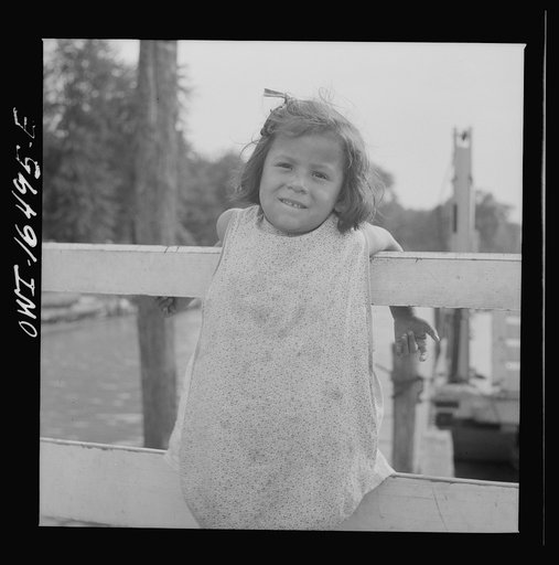 Detroit, Michigan. A Venetian night party at the Detroit yacht club, whose members represent the wealthier class of manufacturers and their friends. Little girl at the entrance to the yacht club