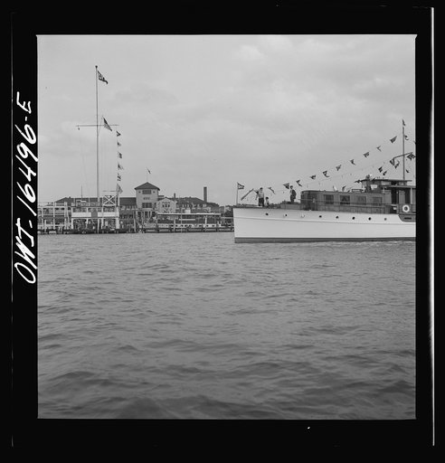 Untitled photo, possibly related to: Detroit, Michigan. A Venetian night party at the Detroit yacht club, whose members represent the wealthier class of manufacturers and their friends. Motorboat