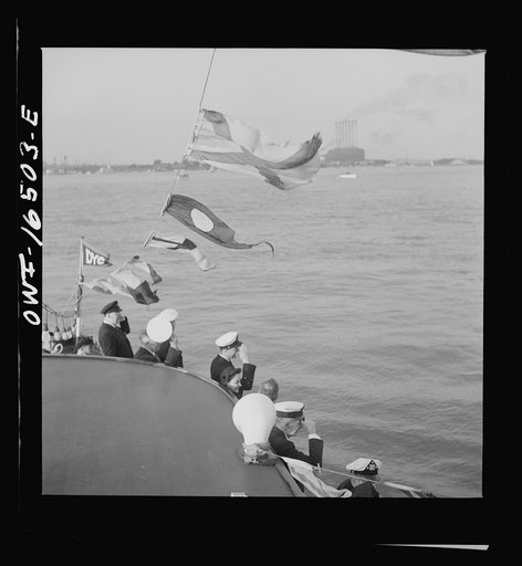 Detroit, Michigan. A Venetian night party at the Detroit yacht club, whose members represent the wealthier class of manufacturers and their friends. Reviewing the fleet