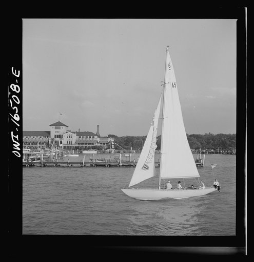Untitled photo, possibly related to: Detroit, Michigan. A Venetian night party at the Detroit yacht club, whose members represent the wealthier class of manufacturers and their friends. Sailing boat