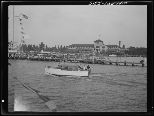 Detroit, Michigan. A Venetian night party at the Detroit yacht club, whose members represent the wealthier class of manufacturers and their friends. Powerboat with the yacht club in the background