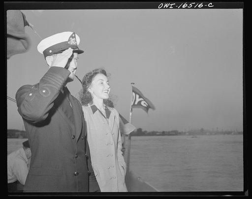 Detroit, Michigan. A Venetian night party at the Detroit yacht club, whose members represent the wealthier class of manufacturers and their friends. The Commodore with a girl, reviewing the fleet