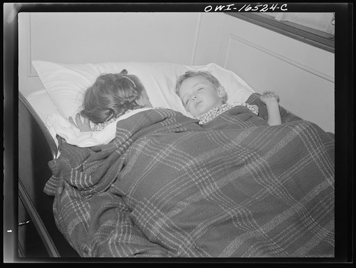 Detroit, Michigan. A Venetian night party at the Detroit yacht club, whose members represent the wealthier class of manufacturers and their friends. Children sleeping