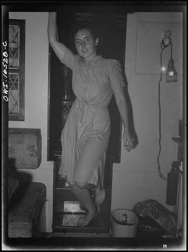 Untitled photo, possibly related to: Detroit, Michigan. A Venetian night part at the Detroit yacht club, whose members represent the wealthier class of manufacturers and their friends. Girl with clothing swimming