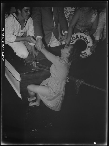 Untitled photo, possibly related to: Detroit, Michigan. A Venetian night part at the Detroit yacht club, whose members represent the wealthier class of manufacturers and their friends. Girl with clothing swimming