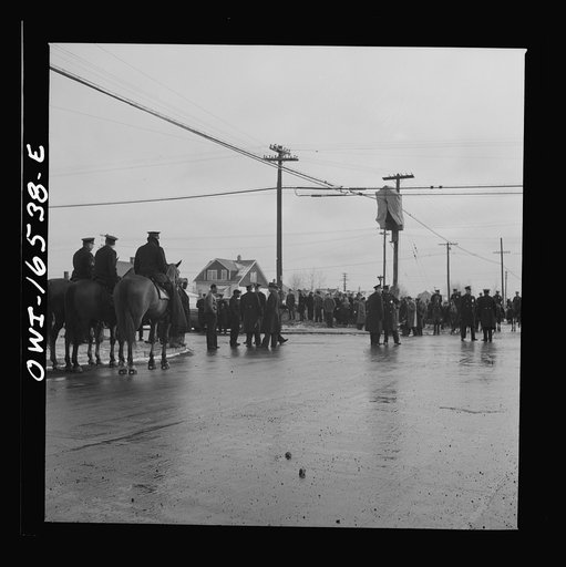 Untitled photo, possibly related to: Detroit, Michigan. Riot at the Sojourner Truth homes, a new U.S. federal housing project, caused by white neighbors' attempt to prevent Negro tenants from moving in. Mounted police moving a group of Negroes