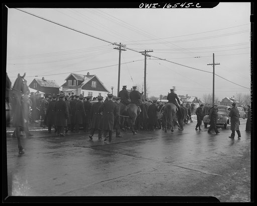 Untitled photo, possibly related to: Detroit, Michigan. Riot at the Sojourner Truth homes, a new U.S. federal housing project, caused by white neighbors' attempt to prevent Negro tenants from moving in. Mounted police