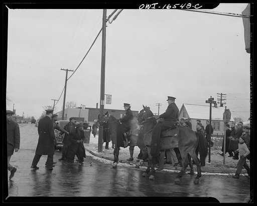 Untitled photo, possibly related to: Detroit, Michigan. Riot at the Sojourner Truth homes, a new U.S. federal housing project, caused by white neighbors' attempt to prevent Negro tenants from moving in. Mounted police and whites