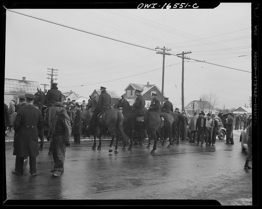 Detroit, Michigan. Riot at the Sojourner Truth homes, a new U.S. federal housing project, caused by white neighbors' attempt to prevent Negro tenants from moving in. Mounted police
