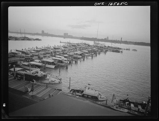 Untitled photo, possibly related to: Detroit, Michigan. A Venetian night party at the Detroit yacht club, whose members represent the wealthier class of manufacturers and their friends. Boats tied up at the club