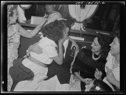 Untitled photo, possibly related to: Detroit, Michigan. A Venetian night party at the Detroit yacht club, whose members represent the wealthier class of manufacturers and their friends. Commodore and girls drinking