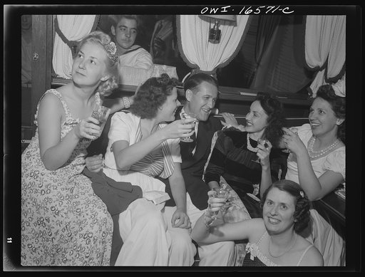 Detroit, Michigan. A Venetian night party at the Detroit yacht club, whose members represent the wealthier class of manufacturers and their friends. Commodore and girls drinking