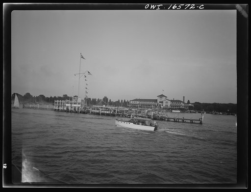 Untitled photo, possibly related to: Detroit, Michigan. A Venetian night party at the Detroit yacht club, whose members represent the wealthier class of manufacturers and their friends. Small cabin crusier